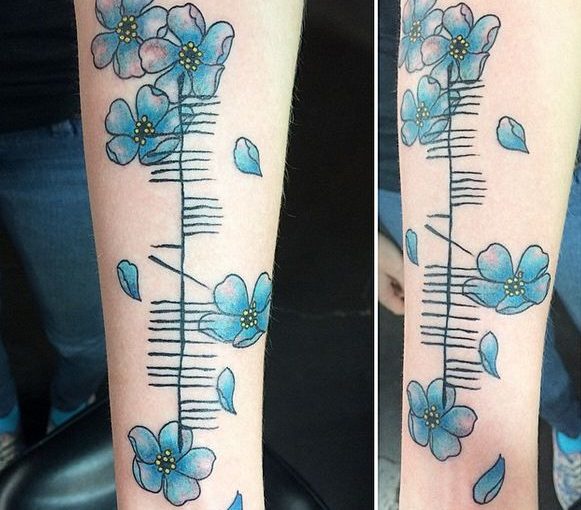 Ogham floral tattoo reading “suaimhneas”, meaning “tranquillity”